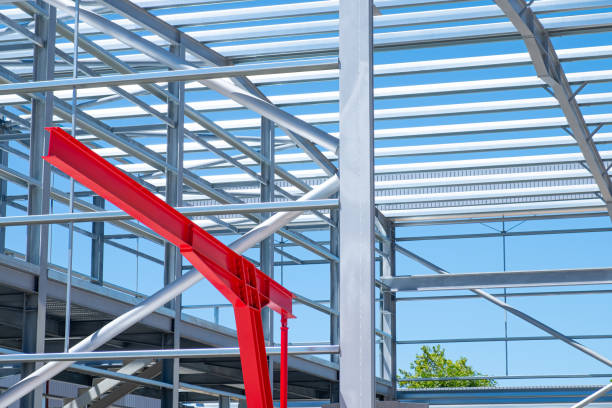 istock steel frame commercial building under construction in urban area. Metallic structure concept 2177065465