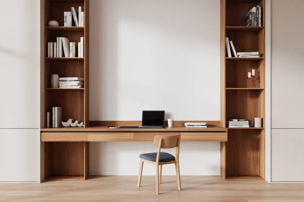 istock Modern home office with minimalist desk and built-in shelves in bright room. 3D Rendering 2177065736
