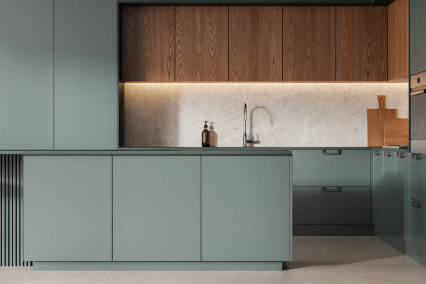 istock Green home kitchen interior with cooking cabinet, bar island and kitchenware 2177066690