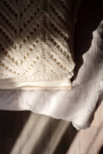 istock Stack of Cozy Knit Sweaters in Natural Light 2177066871