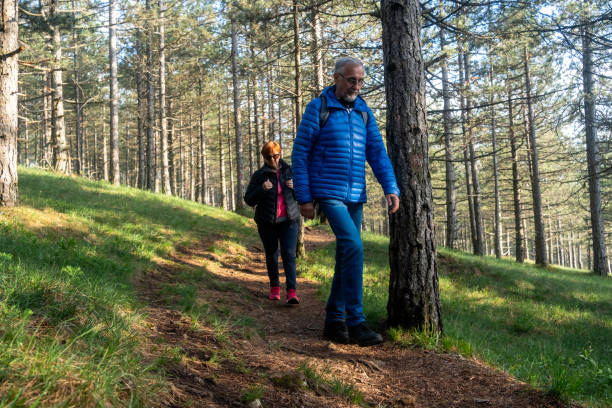 istock Senior couple walking in a forest. 2177068929