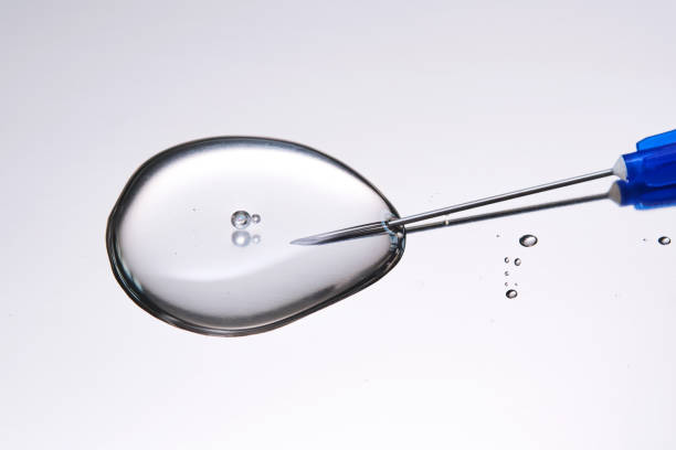 istock A drop of medicine flowing from a syringe with a needle. 2177070743