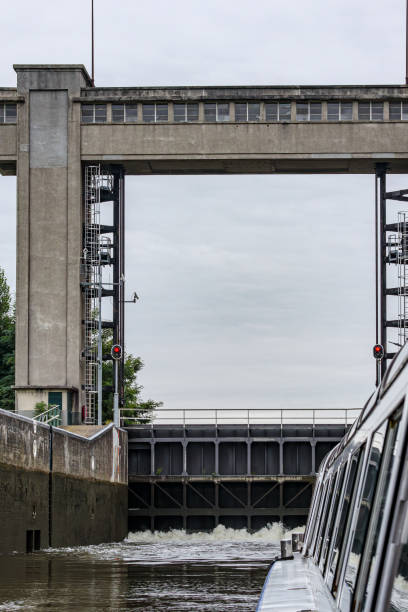 istock Side of ship sailing in Bosscherveld lock, closed gate 2177071307