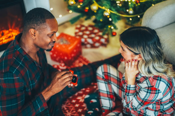 istock Man proposing to his girlfriend on Christmas Eve 2177071973