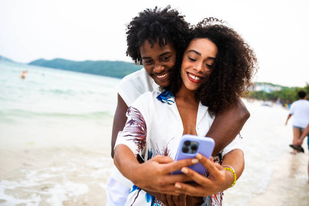 istock Black couple is taking a beach selfie 2177072309