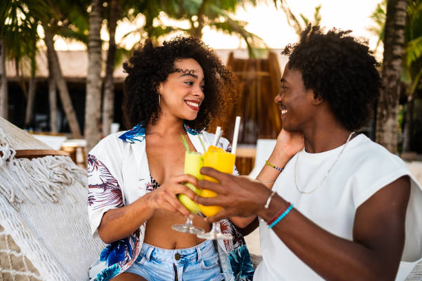 istock Afro couple toasting with cocktails 2177072978