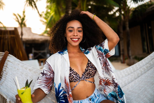 istock Afro woman in a beach lounge bar 2177073051