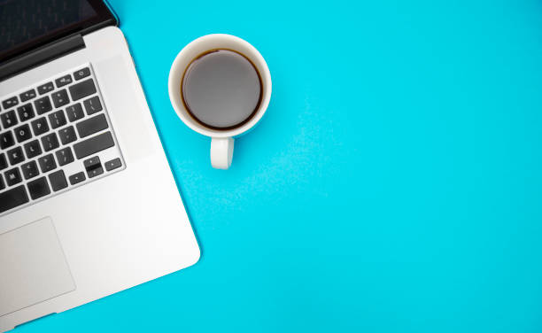 istock Laptop and Coffee on a Bright Blue Desk – Workspace Inspiration 2177079096