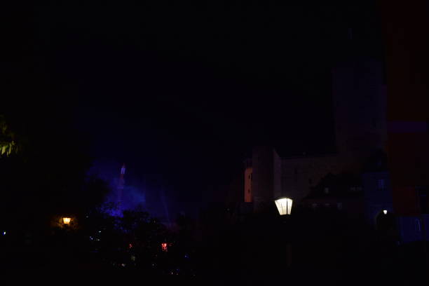 blue and purple lights and fog in the streets, above head level