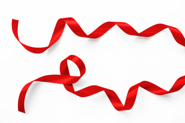 istock Red ribbon roll satin bow texture isolated on white background with clipping path 2177082772