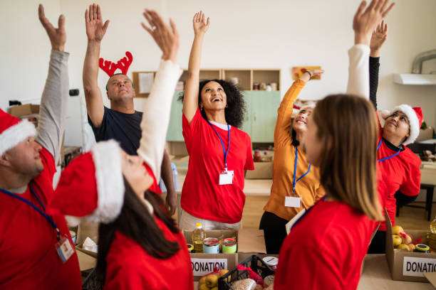 istock Volunteers with a team building exercise at Christmas 2177082875