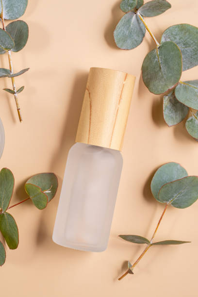 istock Blank matte glass essential oil bottle with pipette on beige background decorated eucalyptus leaves. Skin care concept with natural cosmetics 2177083189