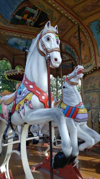 istock Vintage, white carousel horses 2177085698
