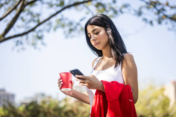 istock Young woman is using online banking on mobile phone. 2177085841