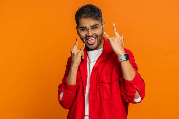 istock Happy Indian man showing rock n roll gesture by hands cool sign crazy expression dancing victory win 2177086848