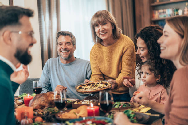 istock Family enjoy Thanksgiving lunch together 2177089549