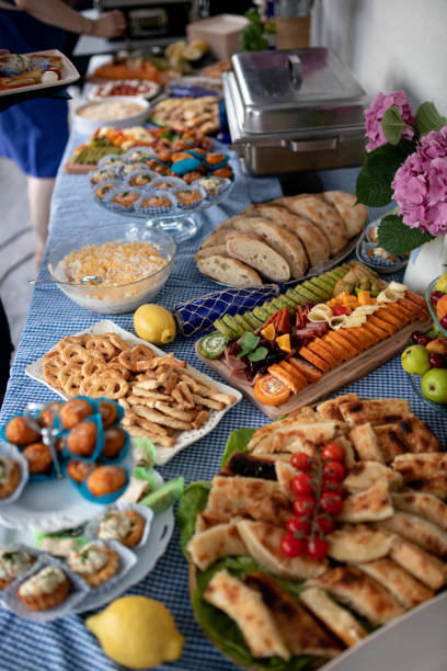 istock Woman taking food from breakfast table 2177090850