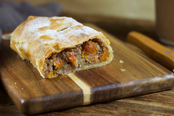 istock Pie with apple and dried apricot lies on a board 2177092264