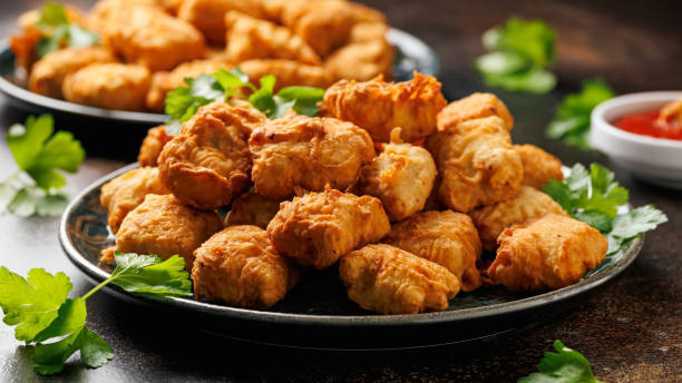 istock Homemade crispy fried chicken nuggets served with ketchup 2177093749