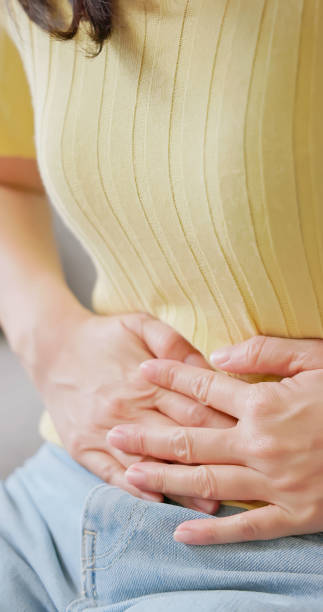 istock asian woman has belly pain 2177093941