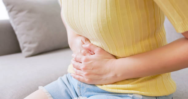 istock asian woman has belly pain 2177094007