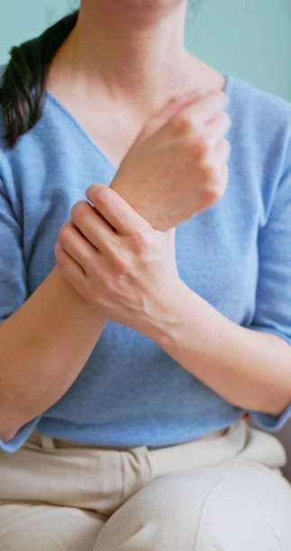 istock asian woman has wrist pain 2177094208