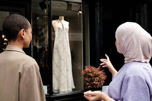 istock Unrecognizable female friends looking at a window shop. 2177095585