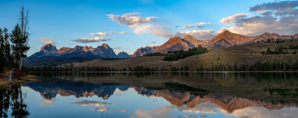 istock Little Redfish Lake reflection with white swan 2177098870