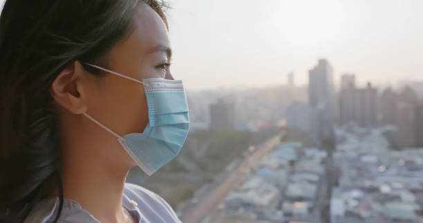 istock mask woman prevent air pollution 2177104560