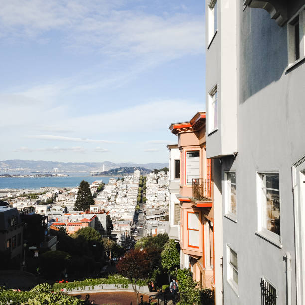 Cable car drives towards suspension bridge, San Francisco