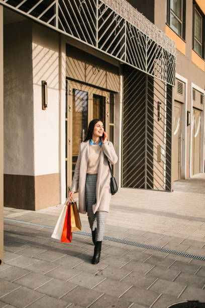 istock Woman with shopping bags 2177106120