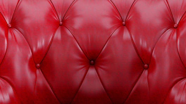 istock A close-up view of a red leather surface featuring an intricate tufted pattern. 2177107050