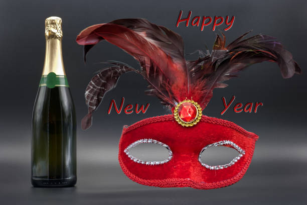 Champagne bottle isolated on beautiful shiny background with happy new year lettering