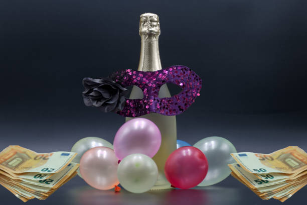 ...A bottle of champagne isolated on a beautiful shiny background with euro banknotes