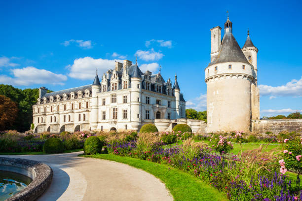 Chenonceau, Indre-et-Loire department, Centre-Val de Loire, France: Château de Chenonceau spanning the river Cher and the medieval Keep, one of the best-known châteaux of the Loire Valley, UNESCO World Heritage Site. The castle consists of an almost square residential building, which is adjoined by a gallery to the south. The two buildings stand in the water of the Cher.
