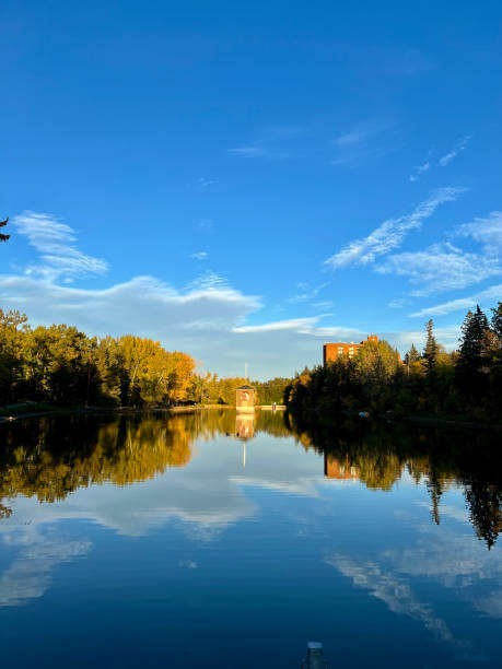 istock Reflection in Lake Small Building and Sky 2177108812