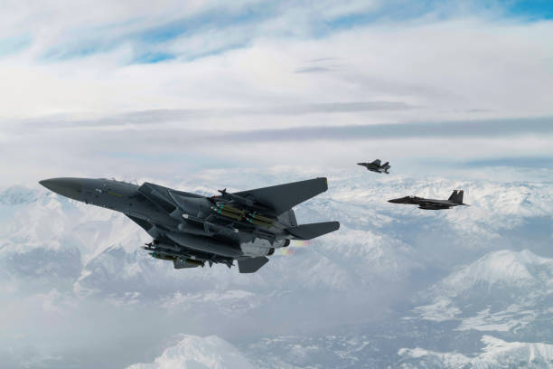 istock F-15 Jet Fighters flying over snowcapped mountains. 2177109451