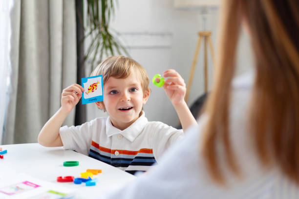 istock Child showing flashcard during educational game 2177110225