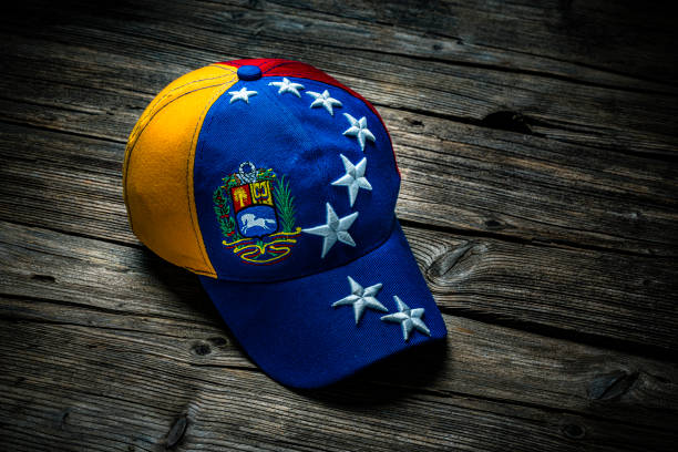 Cap depicting the Venezuelan flag shot on rustic wooden table