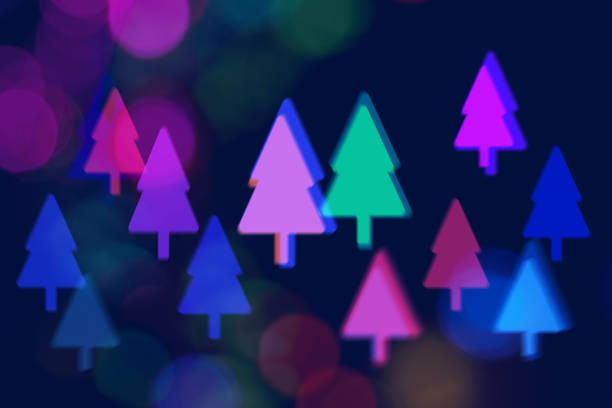 Multiple blurred coloured graphic Christmas Tree shapes. One of a set.