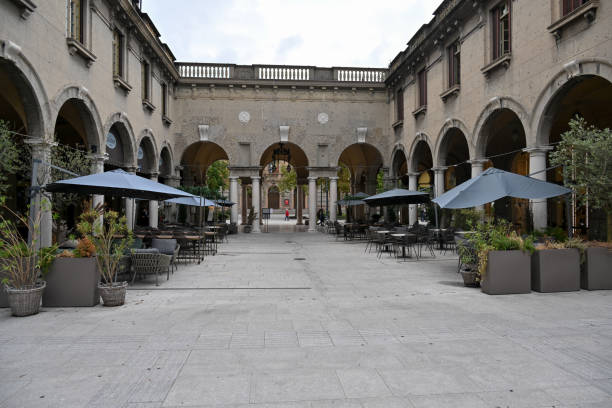 Courtyard on Via Sentierone, a place for strolling and shopping in Bergamo, with a long arcade that houses stores and trendy bars.