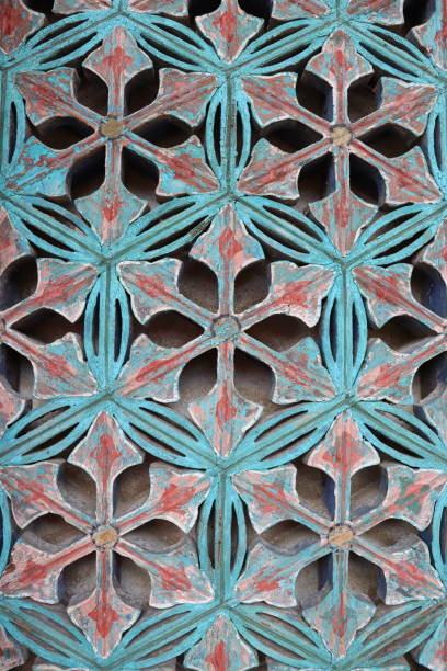 Colorful geometric pattern decorating the wall of a building, showing vibrant colors and intricate details