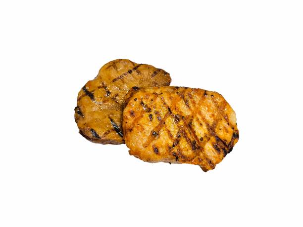 istock Black paper pork steak isolated on white background. Grilled pork meat 2177120190