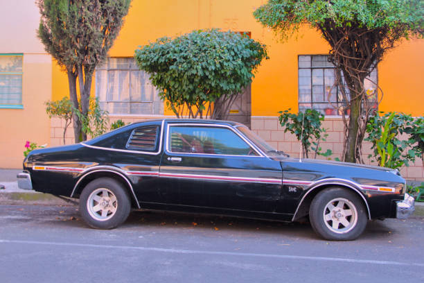 istock Vintage Black Coupe Parked on a Sunny Street 2177124230