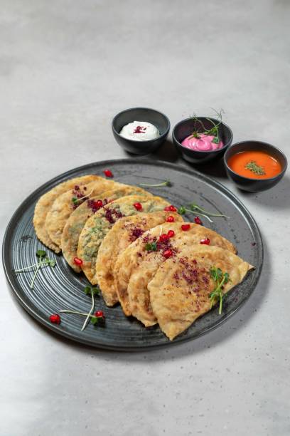 istock Savory flatbreads are served on a plate with dipping sauces 2177124777