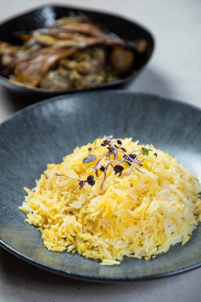 istock Saffron rice being served with chicken and eggplant dish 2177124864