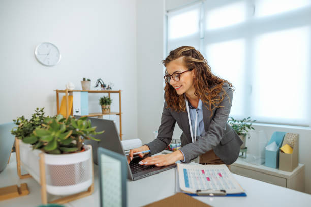istock Young beautiful businesswoman using laptop at the office 2177131051