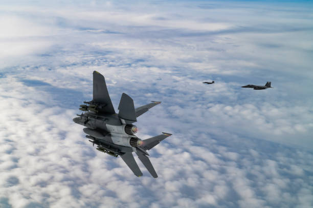 istock F-15 Jet Fighters flying over clouds. 2177131160