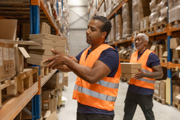 istock Two middle aged multi ethnic male warehouse workers during the daily duties on site 2177133181