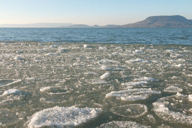 istock frozen lake with rocky distant hills 2177133471